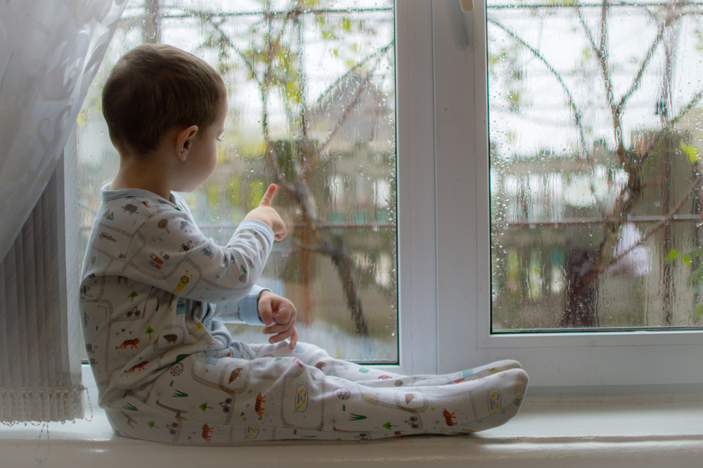 Toddler_Sitting_At_Window